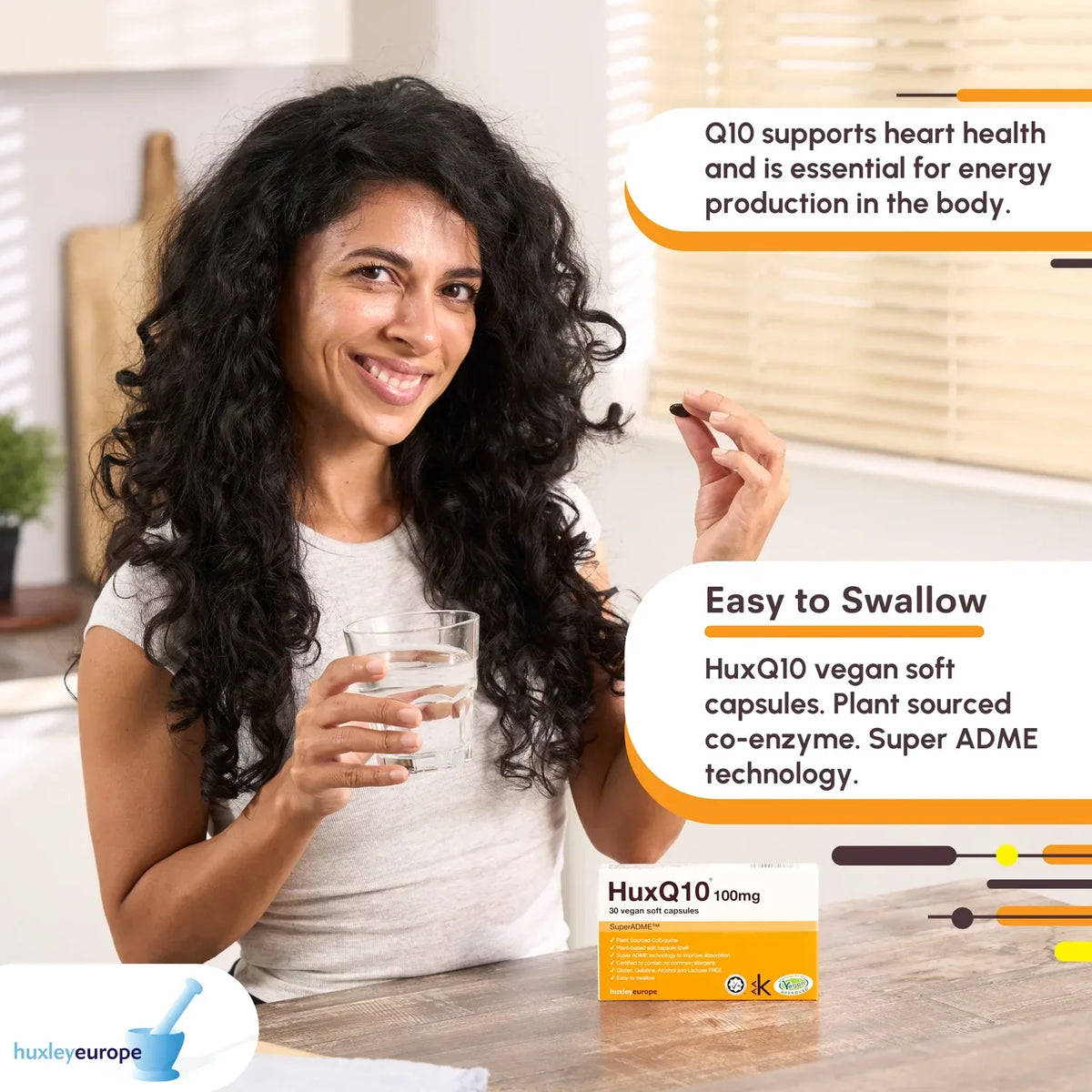 Smiling woman holding a glass of water and a HuxQ10 Coenzyme Q10 vegan soft capsule.